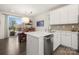 Modern kitchen with stainless steel appliances and white cabinets at 414 W Tremont Ave, Charlotte, NC 28203