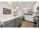 Modern kitchen with gray island and stainless steel appliances at 414 W Tremont Ave, Charlotte, NC 28203