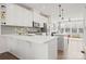 Open kitchen with white cabinets and large island at 414 W Tremont Ave, Charlotte, NC 28203