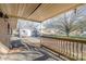 Covered back deck with room for seating, view of backyard and storage shed at 48780 N Us 52 Hwy, Richfield, NC 28137