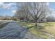 Long gravel driveway leading to a cozy home and outbuildings at 48780 N Us 52 Hwy, Richfield, NC 28137