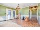 Living room with dated wood flooring and french doors leading to the back deck at 48780 N Us 52 Hwy, Richfield, NC 28137