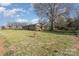 Sprawling yard featuring mature trees surrounding a well-maintained home at 48780 N Us 52 Hwy, Richfield, NC 28137