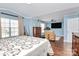 Bedroom with a king-size bed and adjacent sitting area at 4944 Cornelia Dr, Charlotte, NC 28269