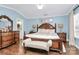 Main bedroom with a king-size bed and ensuite bathroom at 4944 Cornelia Dr, Charlotte, NC 28269