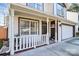 Charming front porch with white railings, a welcoming sign, and potted plants at 4944 Cornelia Dr, Charlotte, NC 28269