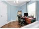 Bright home office features built-in desk and hardwood floors at 4944 Cornelia Dr, Charlotte, NC 28269