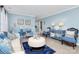 Light blue living room with tiled floors, comfy sofas, and tasteful decor at 4944 Cornelia Dr, Charlotte, NC 28269