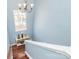 Upstairs landing with light blue walls and a decorative console table at 4944 Cornelia Dr, Charlotte, NC 28269