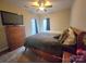 Cozy bedroom with carpet, ceiling fan, and dresser at 5421 Roberta Meadows Ct, Concord, NC 28027