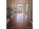 Bright foyer with hardwood floors, decorative columns, and ample natural light at 5421 Roberta Meadows Ct, Concord, NC 28027