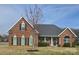 Charming brick home with a manicured lawn and a welcoming front porch at 5421 Roberta Meadows Ct, Concord, NC 28027