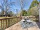 Deck with table and chairs, overlooking the backyard at 6412 Wheeler Dr, Charlotte, NC 28211