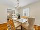 Bright dining room with hardwood floors and chandelier at 6412 Wheeler Dr, Charlotte, NC 28211