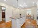 Spacious kitchen with island and hardwood floors at 6412 Wheeler Dr, Charlotte, NC 28211