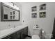 Clean bathroom with a vanity, toilet, and framed artwork at 6475 Highway 73 E Hwy, Mount Pleasant, NC 28124