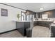 Kitchen with dark cabinetry, breakfast bar, and stainless steel appliances at 6475 Highway 73 E Hwy, Mount Pleasant, NC 28124