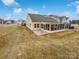 House backyard with patio and screened porch at 744 Bartram Ave, Concord, NC 28025