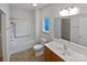 Bathroom with tub, toilet, and vanity with a large mirror at 744 Bartram Ave, Concord, NC 28025