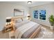 Bright bedroom with a large bed and window at 744 Bartram Ave, Concord, NC 28025