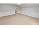 Spacious bedroom with wainscoting and neutral carpet at 744 Bartram Ave, Concord, NC 28025