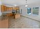 Kitchen with light wood cabinets, granite counters, and island at 744 Bartram Ave, Concord, NC 28025