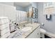 Bathroom with granite countertop, white cabinets, and shower/tub at 8023 Alford Rd, Fort Mill, SC 29707