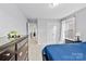 Blue bedroom with double door closet and view of hallway at 8023 Alford Rd, Fort Mill, SC 29707