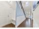 Spacious entryway with built-in bench seating, wood floors, and view of staircase at 8023 Alford Rd, Fort Mill, SC 29707