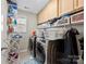 Laundry room with washer, dryer, and storage at 8023 Alford Rd, Fort Mill, SC 29707