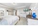 Main bedroom with a large bed, dresser, and plenty of natural light at 8023 Alford Rd, Fort Mill, SC 29707