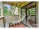 Relaxing balcony with hammock and leafy view at 8049 Charter Oak Ln, Charlotte, NC 28226