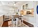 Bright dining area with rustic table and chairs, open to kitchen at 8049 Charter Oak Ln, Charlotte, NC 28226