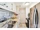 Kitchen with stainless steel appliances and tile countertops at 8049 Charter Oak Ln, Charlotte, NC 28226