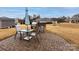 Exterior patio featuring a stone BBQ, outdoor furniture, and beautiful green lawn at 8177 Breton Way, Harrisburg, NC 28075