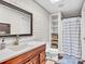 Basement bathroom with wood vanity and checkered floor at 9 Pine Tree Rd, Salisbury, NC 28144