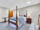 Cozy basement bedroom with a post bed and brick accent wall at 9 Pine Tree Rd, Salisbury, NC 28144