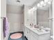 Clean bathroom with double vanity and pink accents at 9 Pine Tree Rd, Salisbury, NC 28144