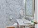 Powder room with marble vanity and stylish floral wallpaper at 9 Pine Tree Rd, Salisbury, NC 28144