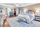 Charming bedroom featuring a stylish bed, accent wall, and rug at 9 Pine Tree Rd, Salisbury, NC 28144