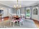 Bright dining room featuring a round table, chandelier, and built-in hutch at 9 Pine Tree Rd, Salisbury, NC 28144