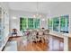 Sun-drenched dining area with a large table and hardwood floors at 9 Pine Tree Rd, Salisbury, NC 28144