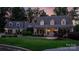 Two-story house with front porch, illuminated windows and manicured lawn at 9 Pine Tree Rd, Salisbury, NC 28144