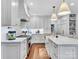 Large kitchen boasting white cabinets, marble countertops, and stainless steel appliances at 9 Pine Tree Rd, Salisbury, NC 28144