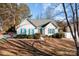 Single-story home with blue shutters and a landscaped yard at 12503 Cumberland Crest Dr, Huntersville, NC 28078