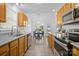 Bright kitchen with stainless steel appliances and granite countertops at 12503 Cumberland Crest Dr, Huntersville, NC 28078