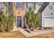 Brick front entrance with black door and landscaping at 1317 New Life Rd, Charlotte, NC 28216