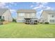 Enjoy outdoor living in this spacious backyard, complete with a lush lawn and a charming deck for relaxation and entertainment at 1356 Middlecrest Dr, Concord, NC 28027