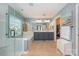 This bathroom features a soaking tub, tiled floors, a separate glass shower, and a double sink vanity at 1356 Middlecrest Dr, Concord, NC 28027