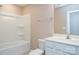 Clean bathroom with a white bathtub and vanity at 152 Suggs Mill Dr, Mooresville, NC 28115